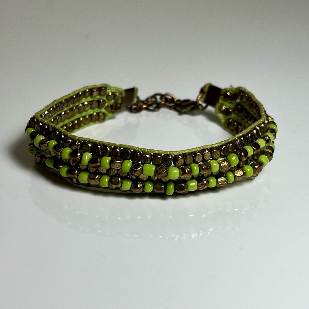 Green and gold beaded bracelet